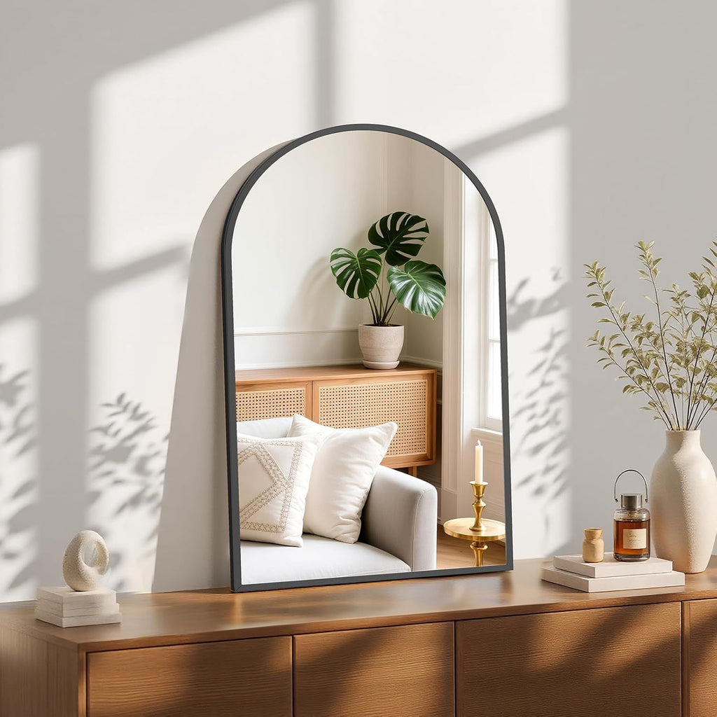 Arched Black Wall Mirror with Vintage-Inspired Character