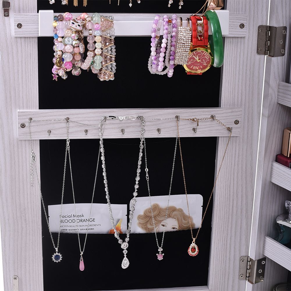 Wall-Mounted Mirrored Jewelry Cabinet With a Locking Door